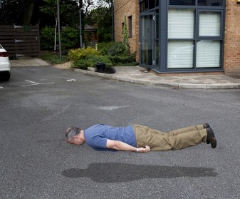 man-levitating-on-road