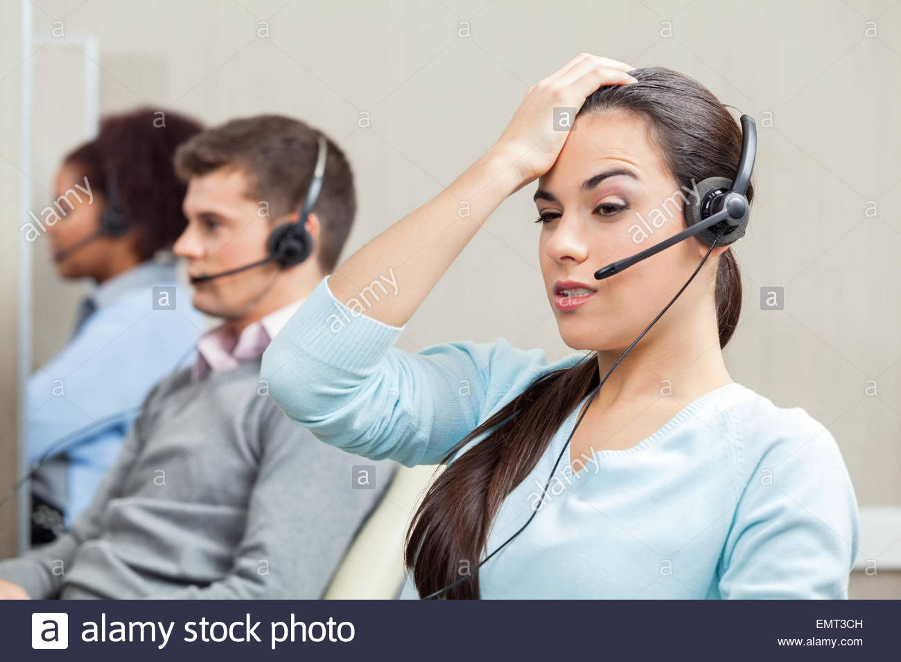 tired-female-customer-service-representative-in-call-center-EMT3CH