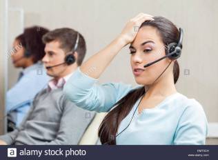 tired-female-customer-service-representative-in-call-center-EMT3CH