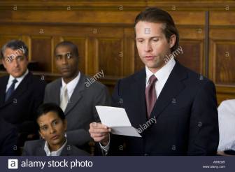 juror-standing-in-a-jury-box-and-reading-the-verdict-A5RE8R